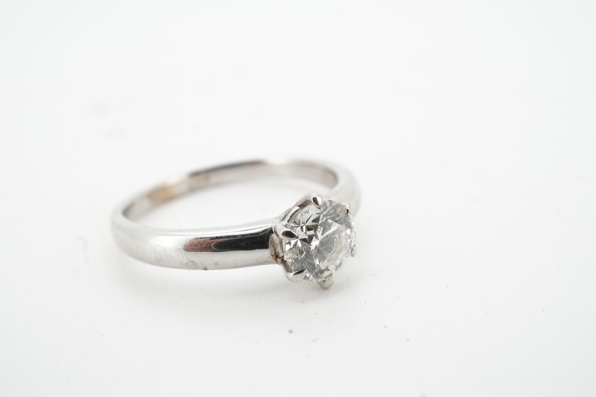 A diamond ring, claw-set with a brilliant-cut diamond weighing approximately 0.80 carats, mounted in white gold, size M, stamped 14K, gross weight approximately 3 grams